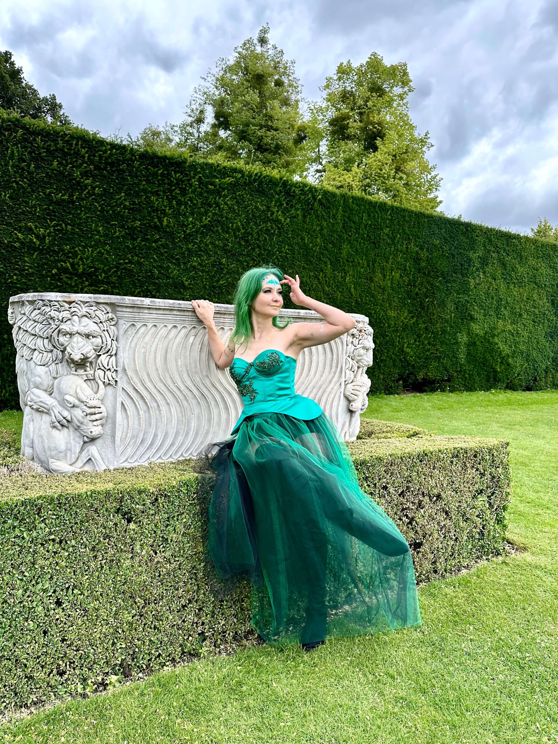 Renata Rimke fashion designer wearing green corset and green tulle skirt